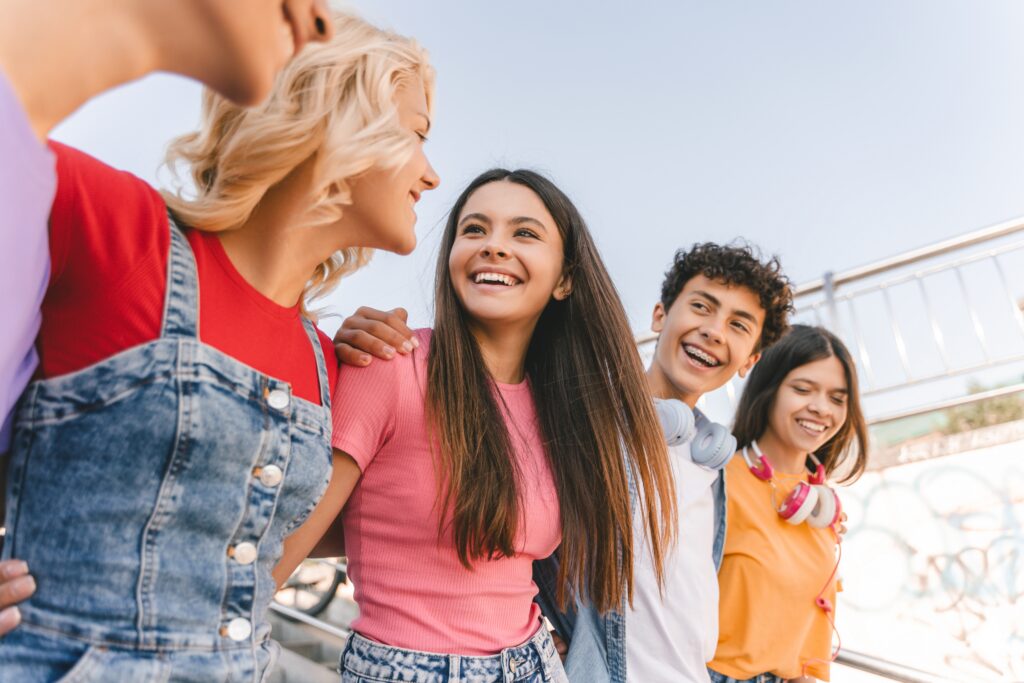 Group of smiling teenage friends