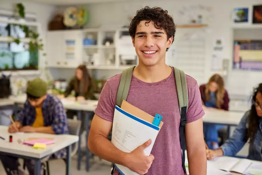 A teenage boy in a classroom