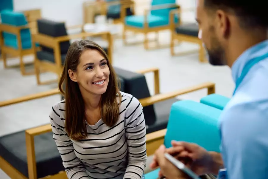 Happy woman in a dental office waiting room